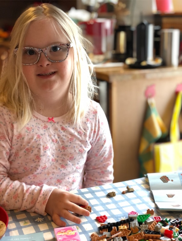 Aune Karru-Olsen works with Legos as part of her distance learning.